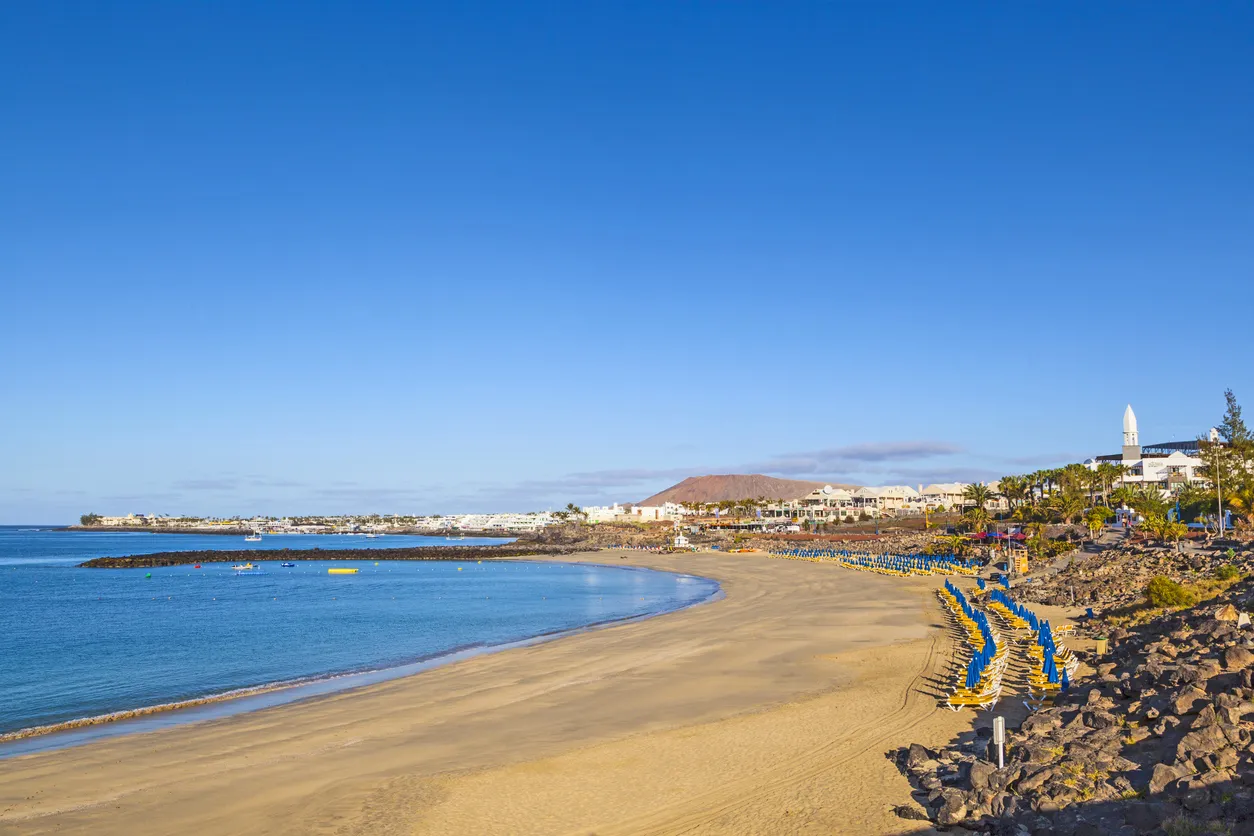 beach promenade of Playa Blanca without people in early morning