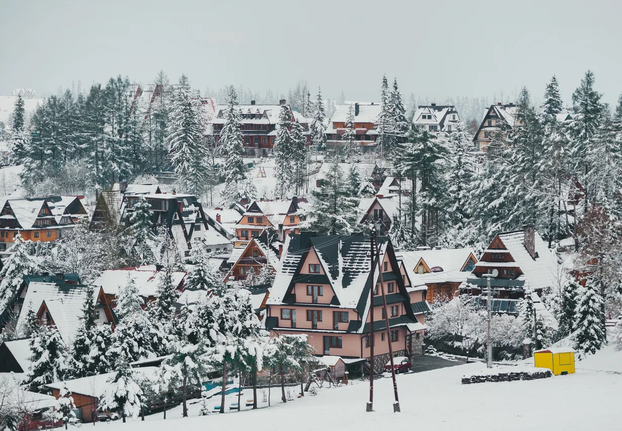 Tatra mountain landscape of zakopane with wooden cottages. Panoramic beautiful winter inspirational landscape view.