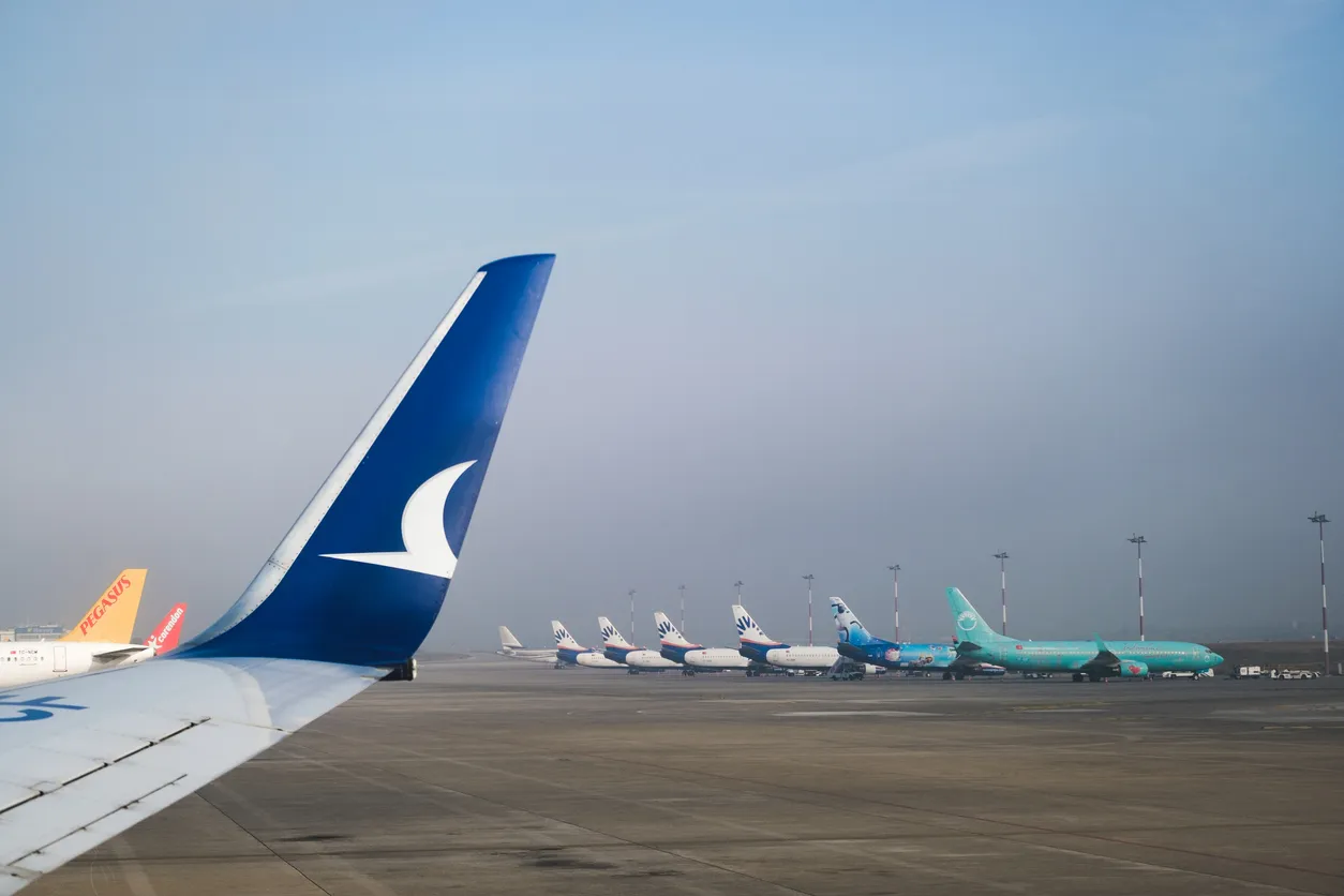 Izmir, Turkey - November 9, 2021: Lined up airplanes on the runway in Izmir Adnan Menderes Airport. Editorial shot in Izmir Turkey.