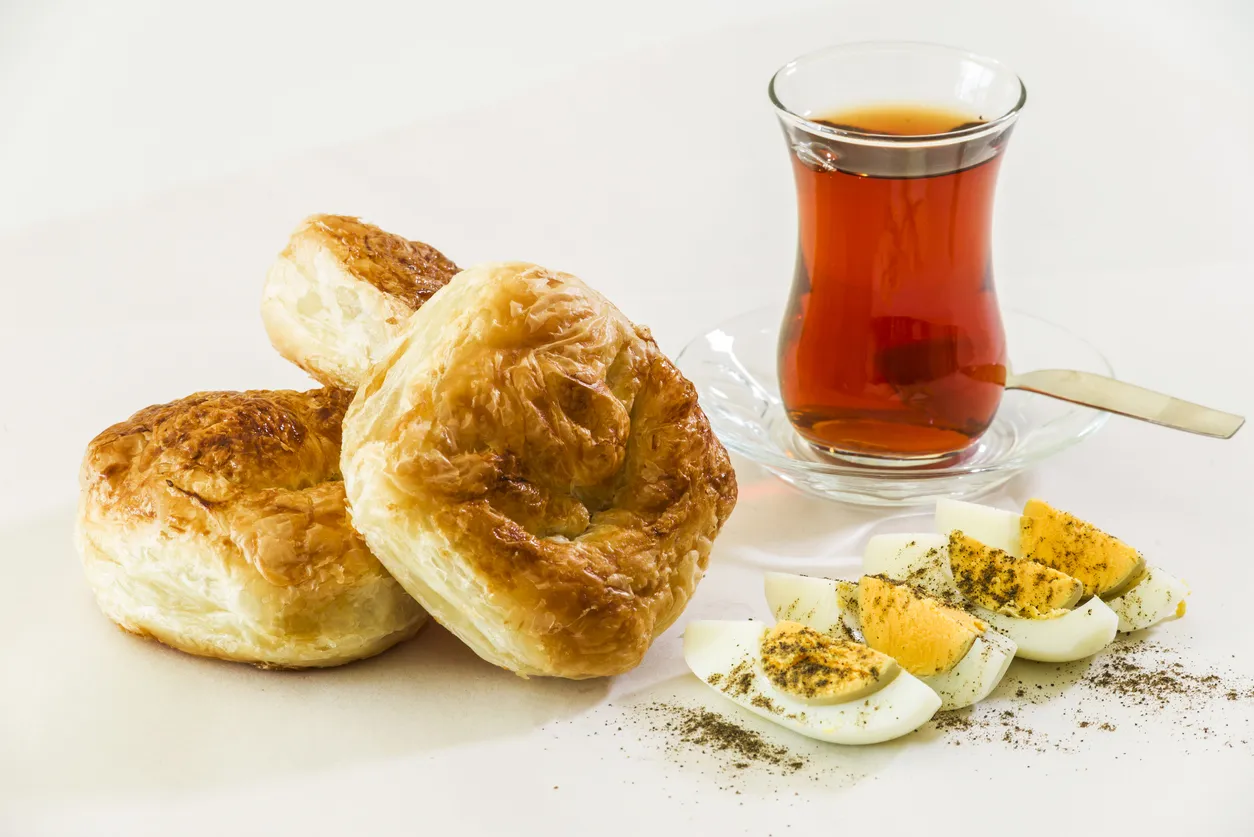 Worker is kneading dough.He is making 
