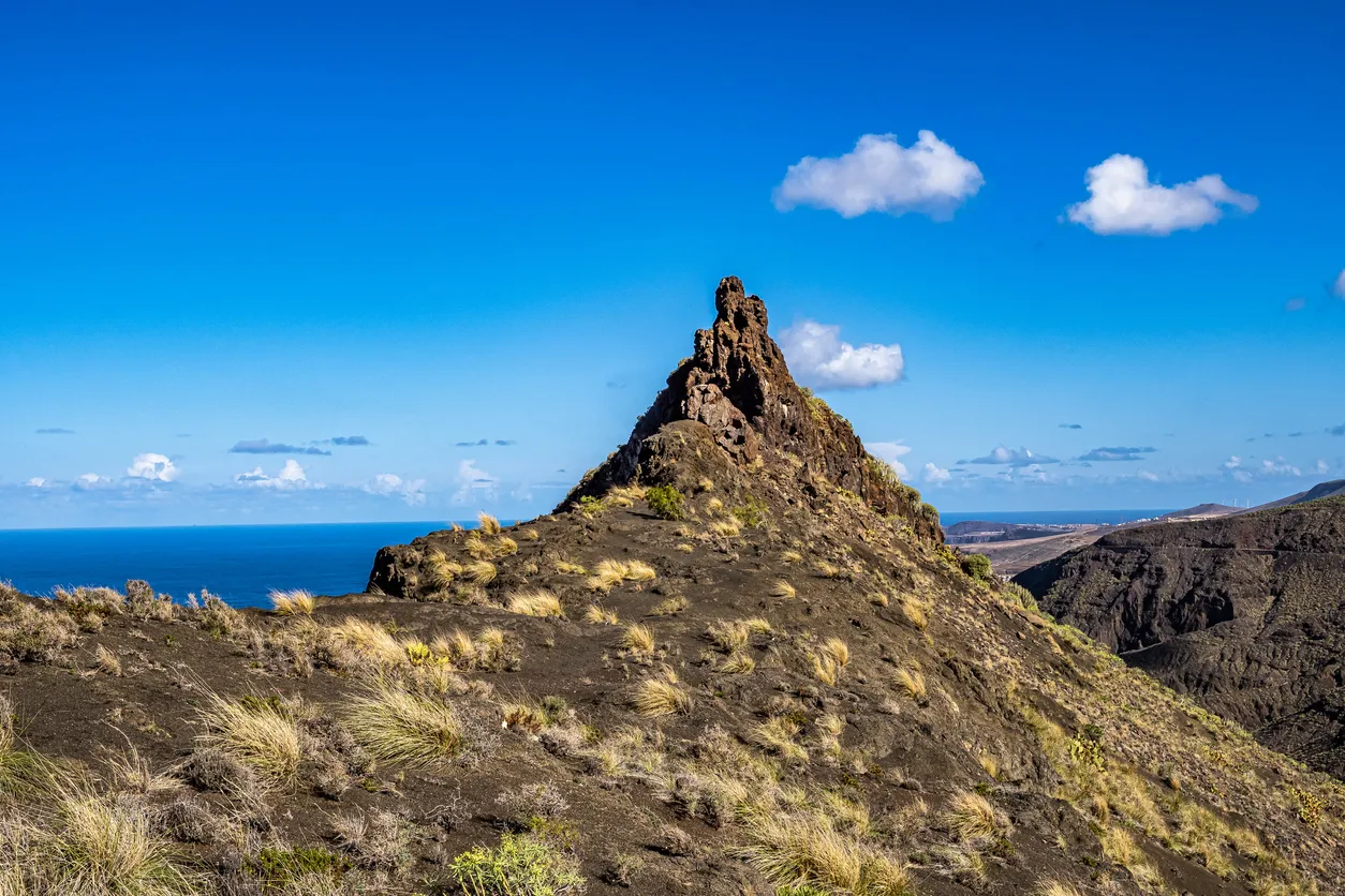 Dedo de Dios, the finger of god, rock formation on the coast of Agaete, Roque Guayedra, Gran Canaria, Spain