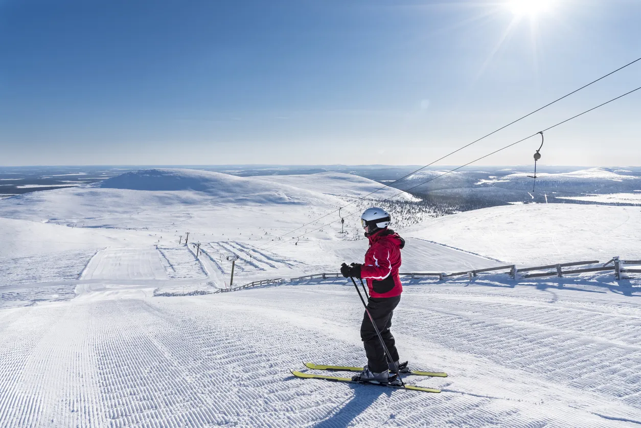 Woman downhill skiing in Lapland Finland
