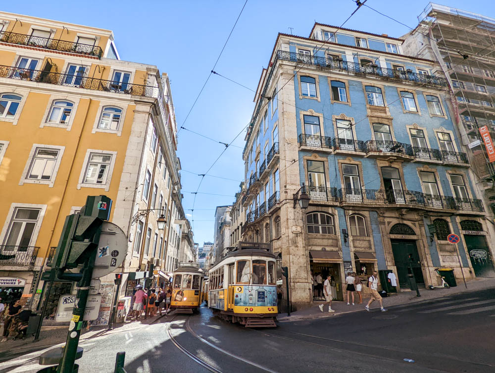 A tram going through historical buildings in Lisbon, a gorgeous snapshot of Lisbon in winter