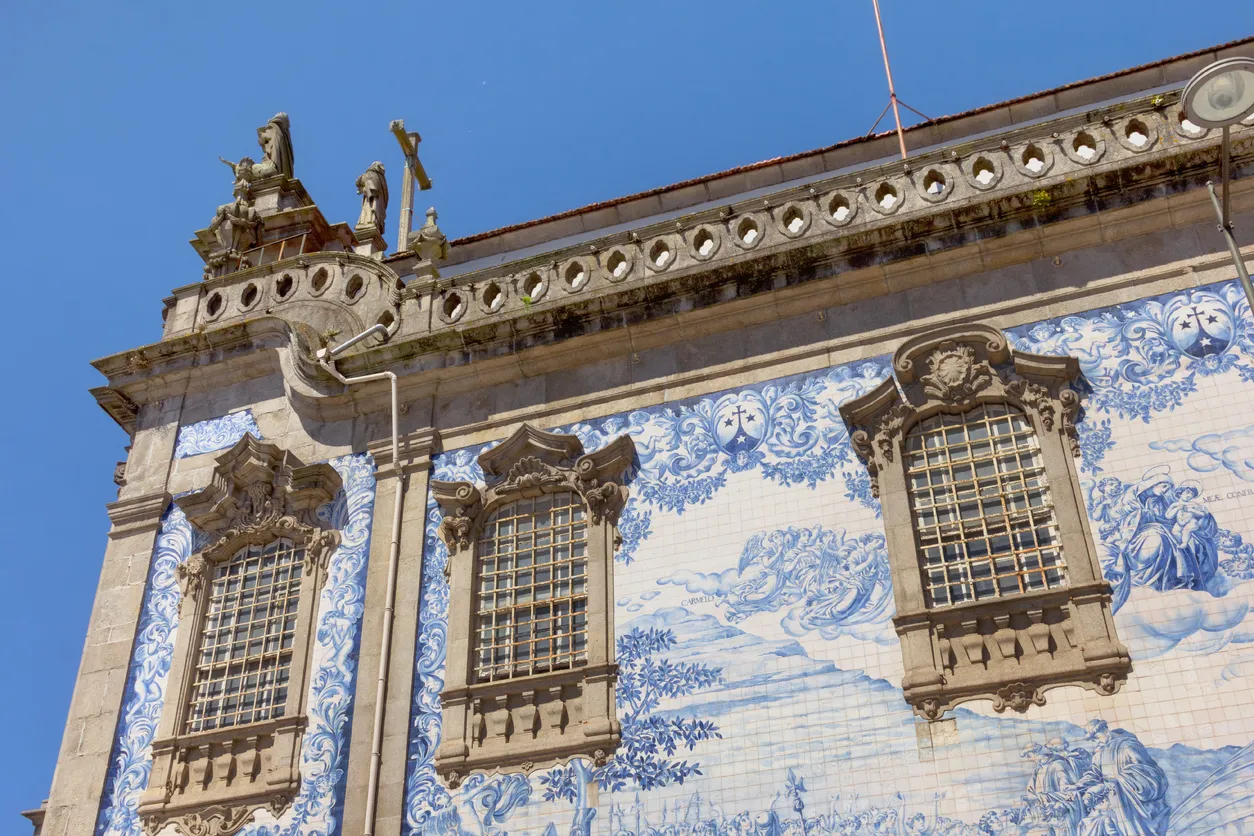 Porto, Portugal - June 16, 2018:Side wall of Carmo and Carmelitas Church with its famous blue and white tiles.