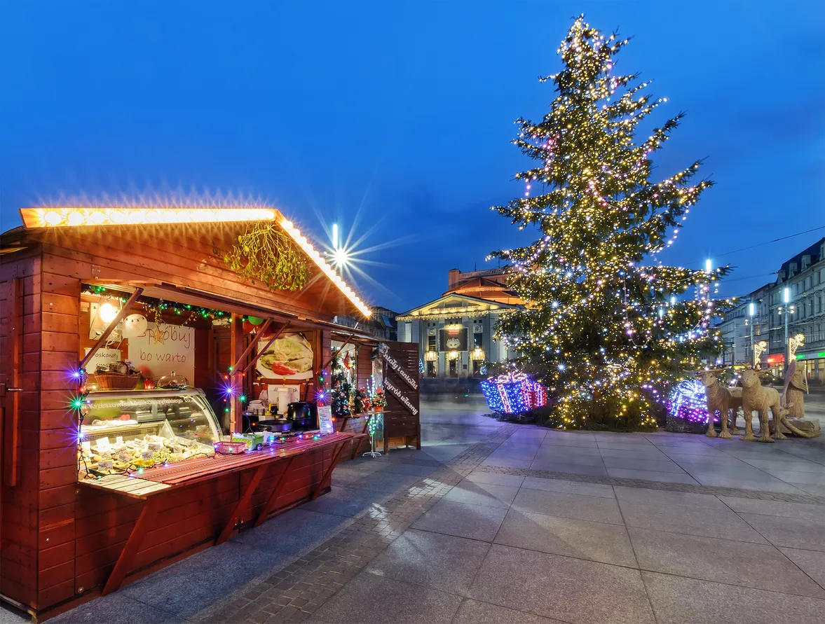Katowice, Poland - December 11, 2015: Traditional street market and Christmas tree in main squere  of Katowice. Katowice is a city in southwestern Poland, with a population of 304,362 as of 2013.