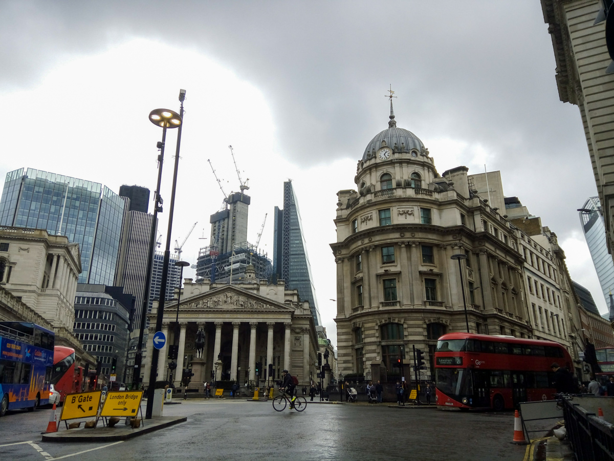 London city centre, with red London buses and historic buildings.