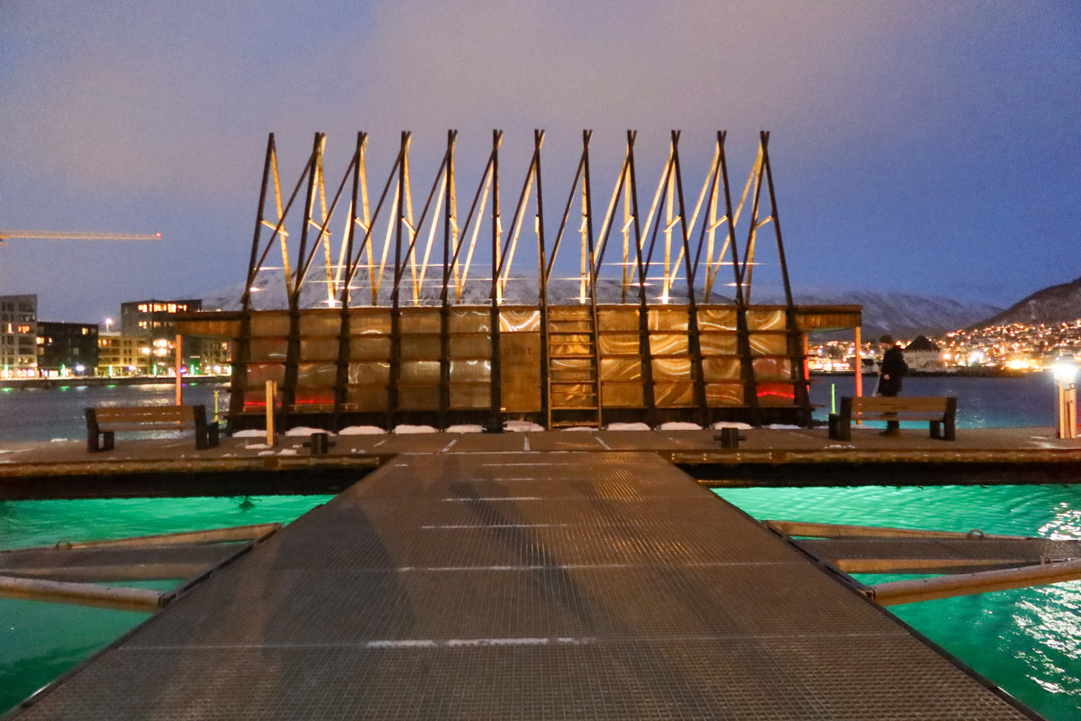 The outside of PUST sauna, sitting on the waters of Tromso harbour in winter