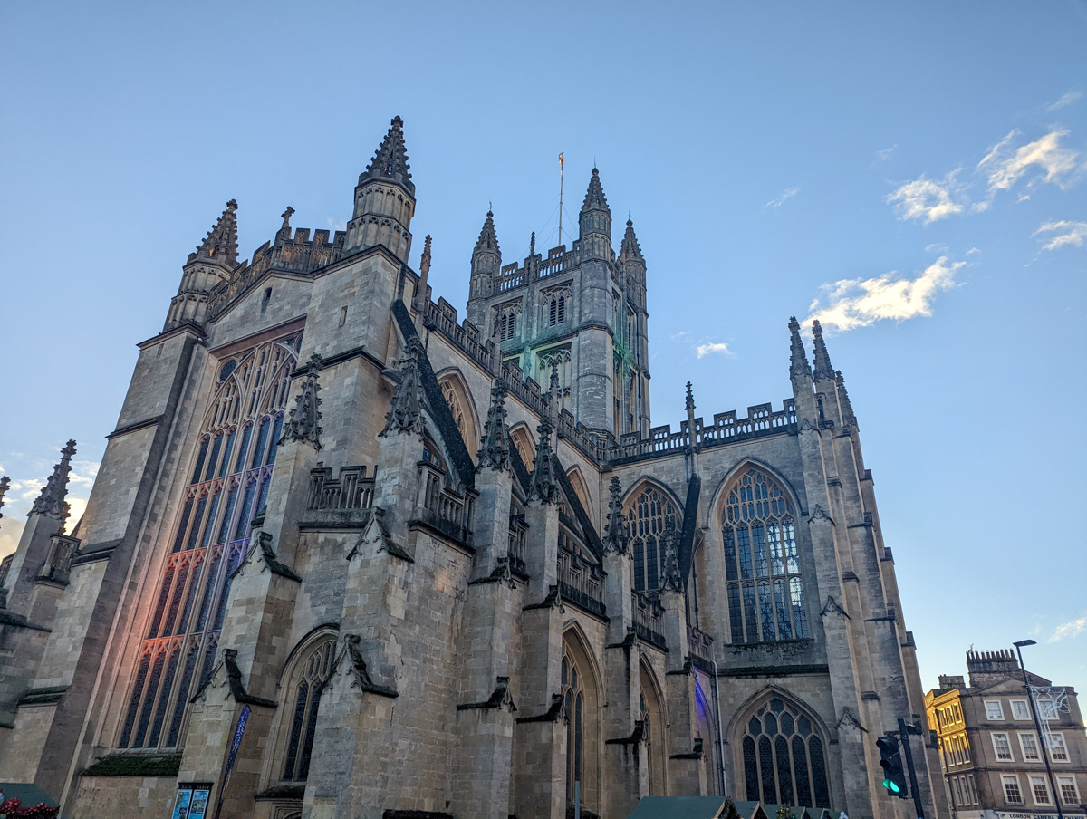 Bath Abbey in winter sunshine with clear skies above. 